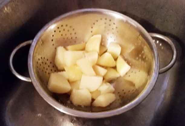 draining potatoes