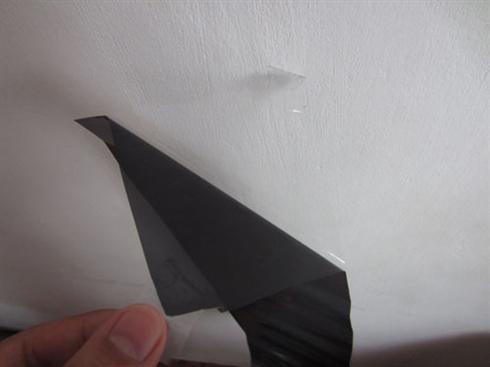 peeling adhesive from liner